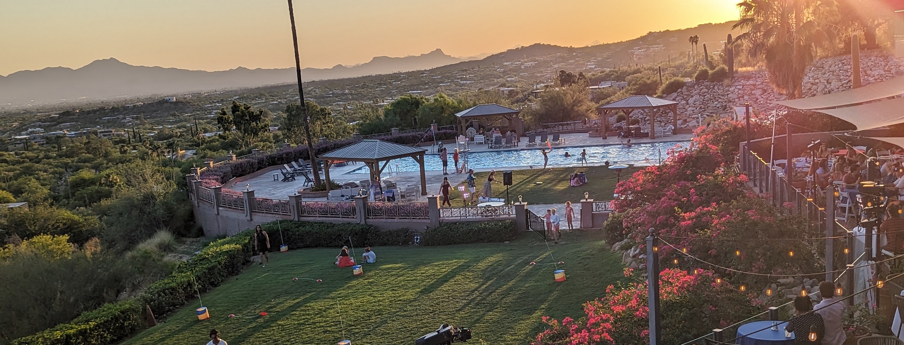 golf course with sun setting behind the mountains