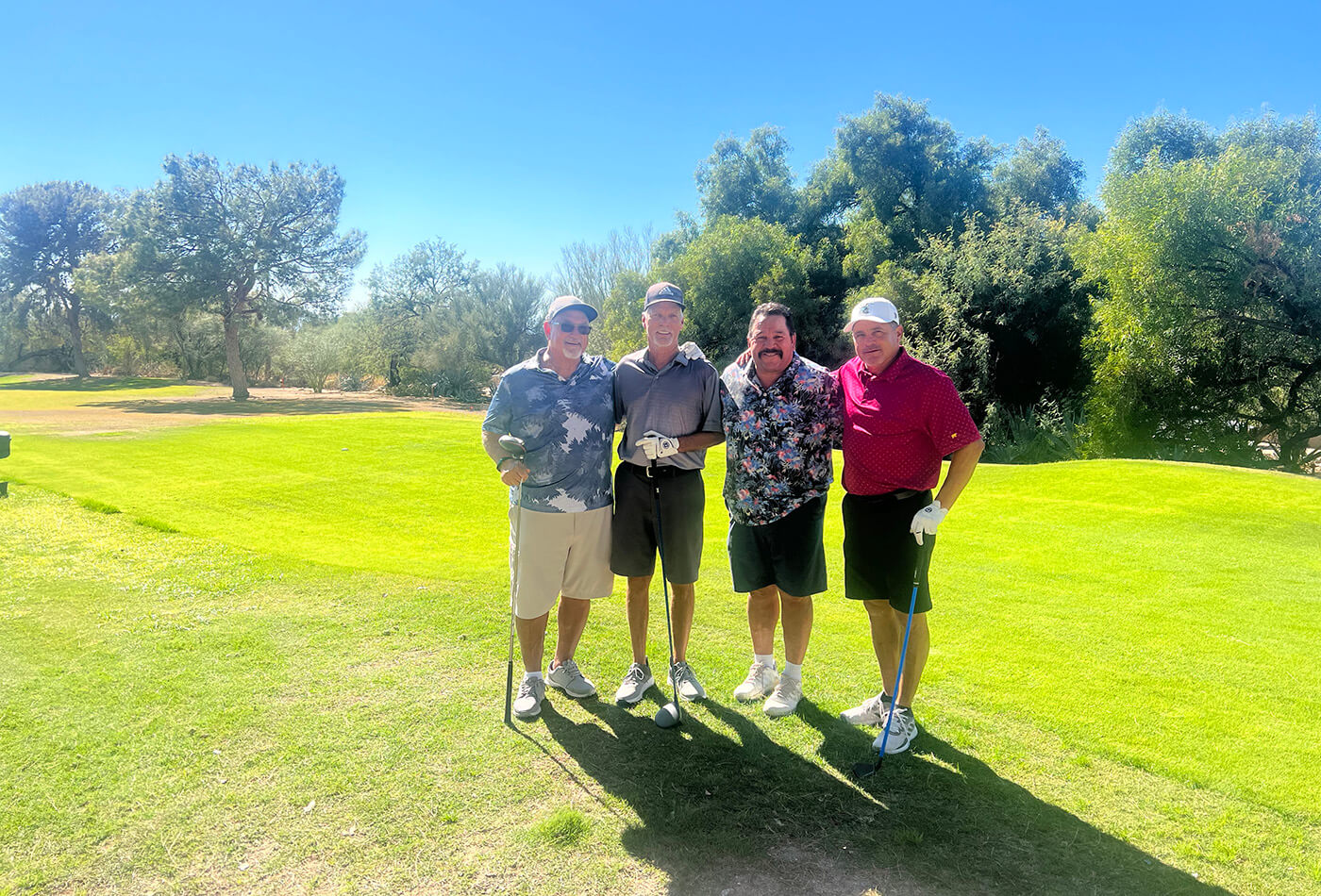 Gentlemen golfers posing for picture