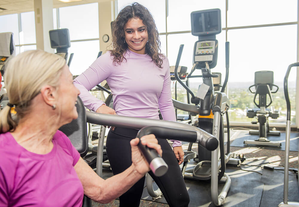 ladies working out on exercise equipment